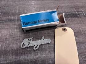General Motors 20696334 1982-1986 Cadillac Fleetwood Brougham Quarter Panel Metal Emblem Nos