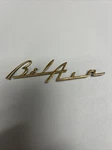1955 1956 Chevrolet Belair Dash Speaker Grille Emblem Script Gold Used. Price: $12.00.
