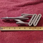 Vintage Chrome 1954 Oldsmobile Super 88 Rocket Emblem Metal Badge Used. Price: $25.00.