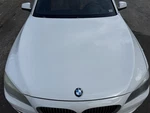 2009-2015 Bmw 750I Hood White Used. Price: $360.00.