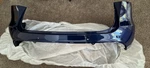 New Oem 20-25 Tesla Y Rear Bumper Fascia Upper Deep Blue 1494005-00-B. Price: $355.50.