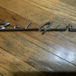 Chevy 50 Trim Emblem Script Chrome Used. Price: $15.00.